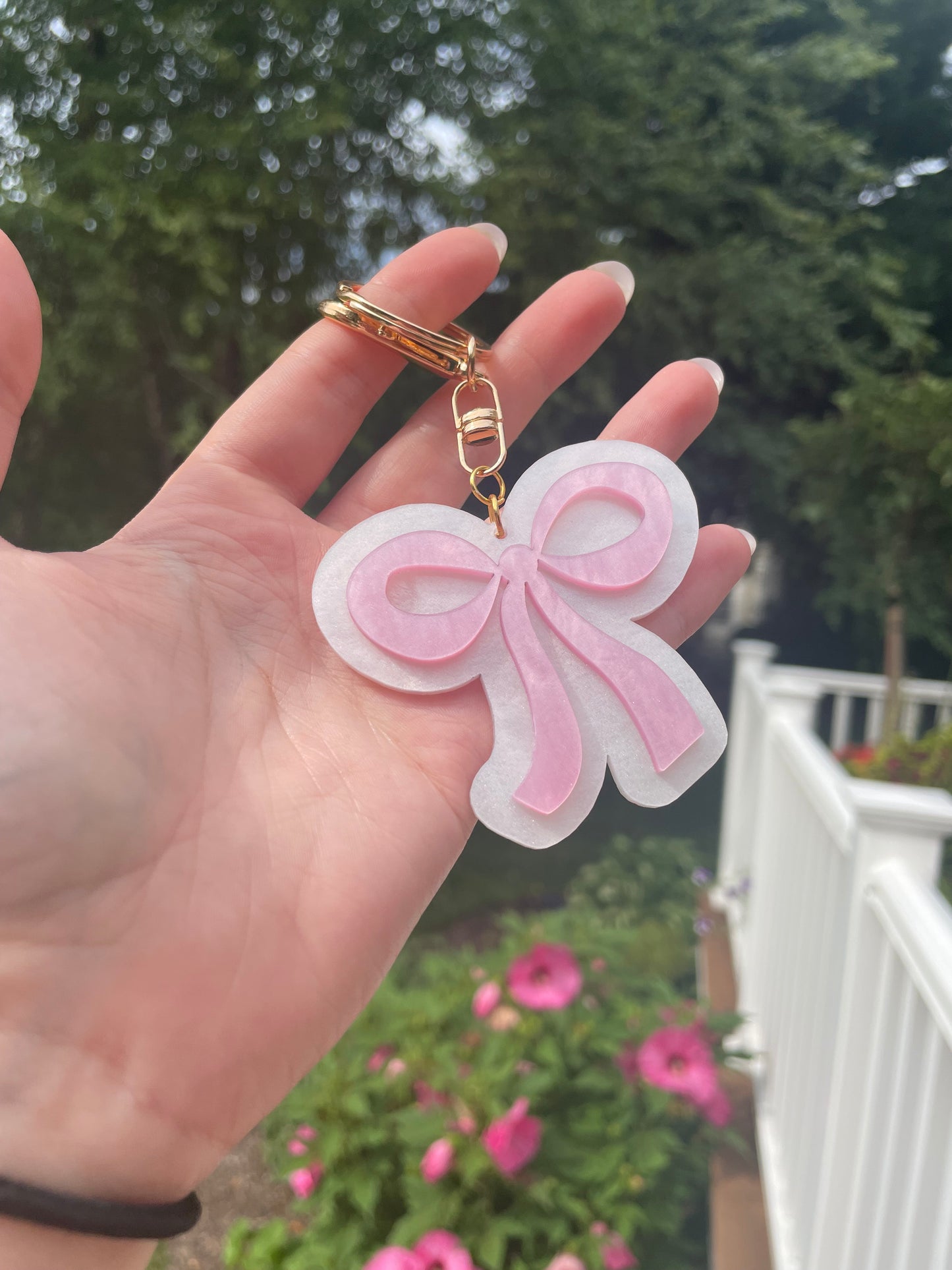 Pearlescent Pink and White Bow Keychain with Gold Features