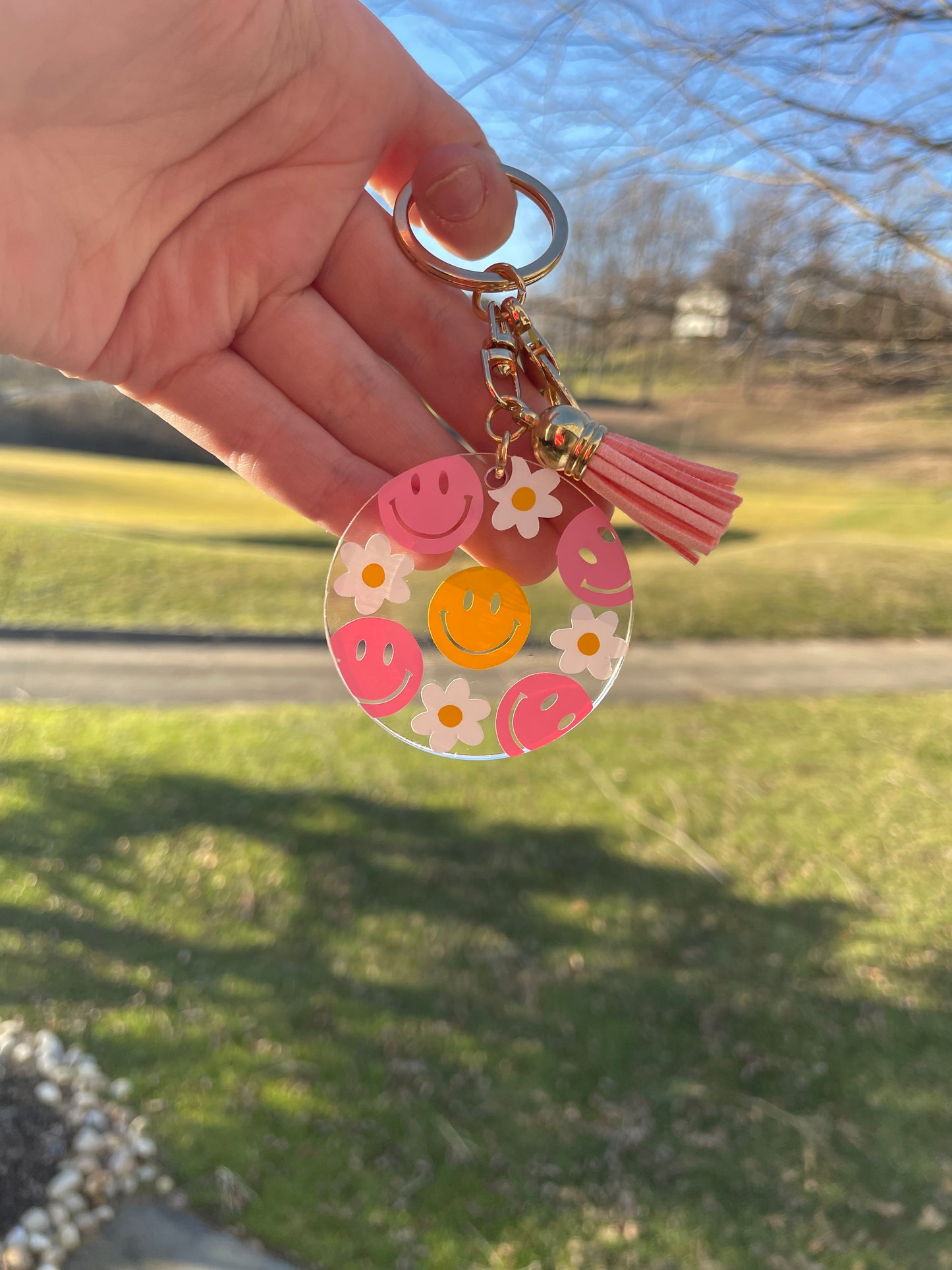 Pink and Yellow Smiley Faces and Flowers Clear Acrylic Keychain with Pink Tassel and Gold Features