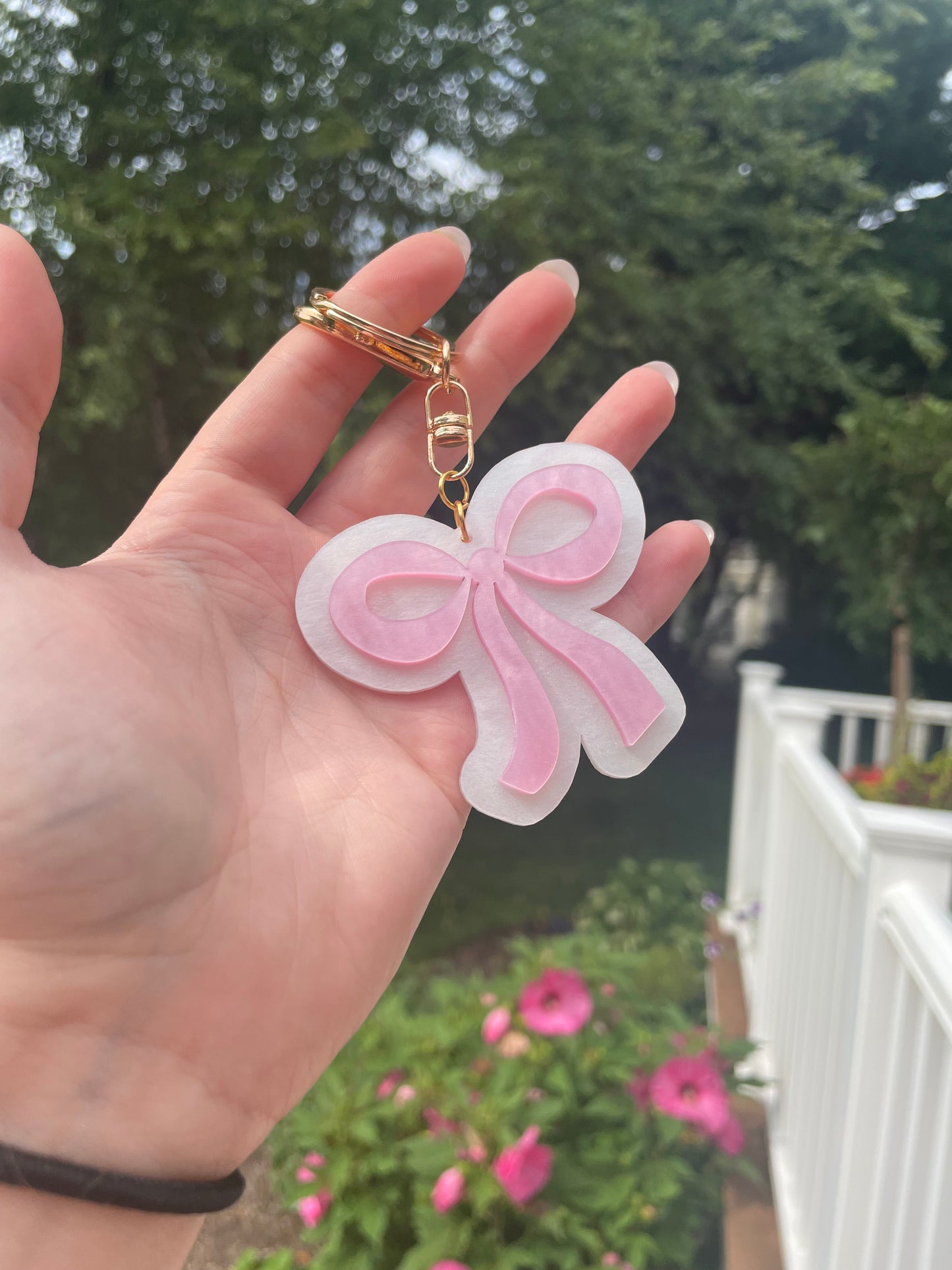 Pearlescent Pink and White Bow Keychain with Gold Features