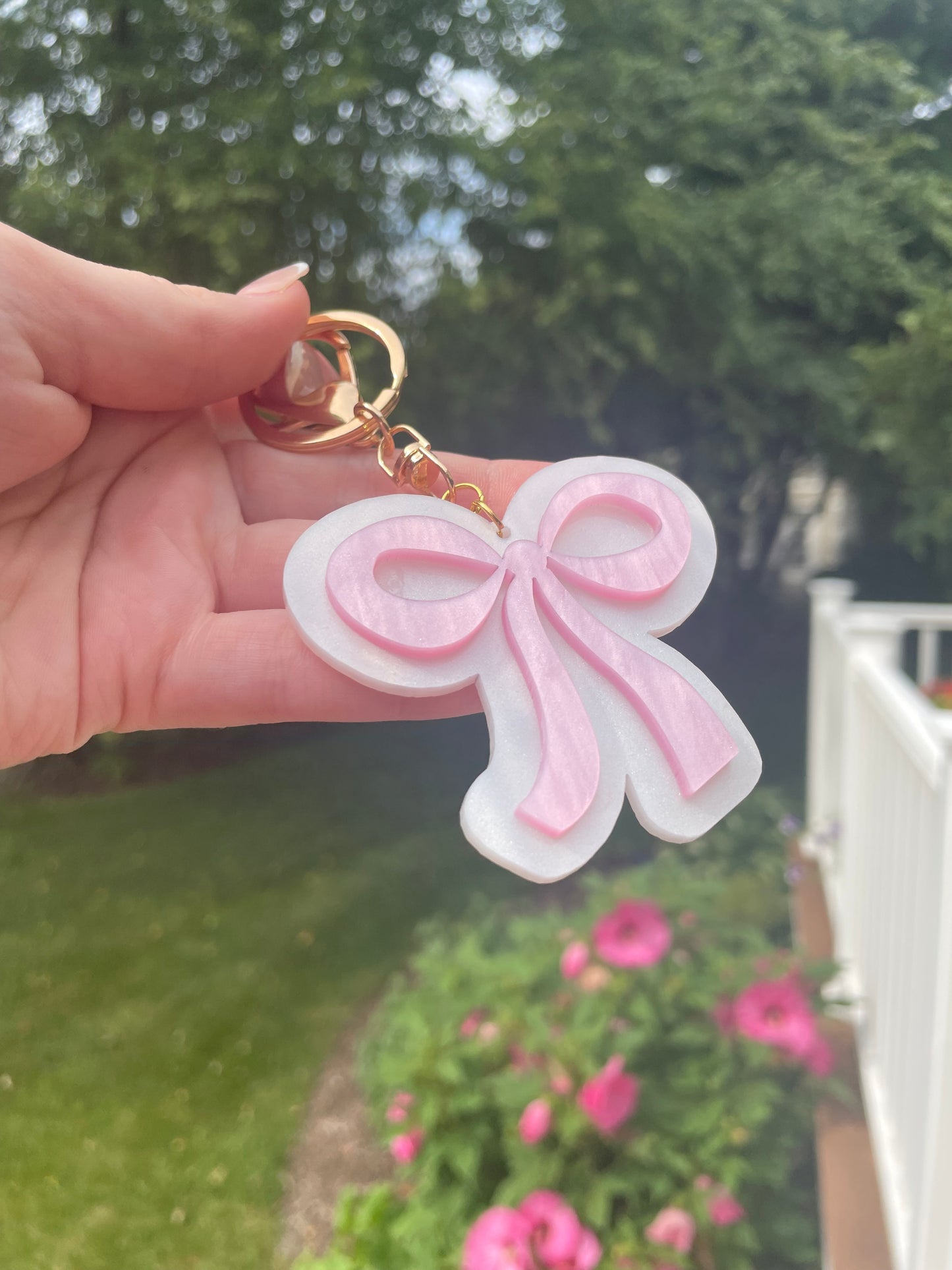 Pearlescent Pink and White Bow Keychain with Gold Features