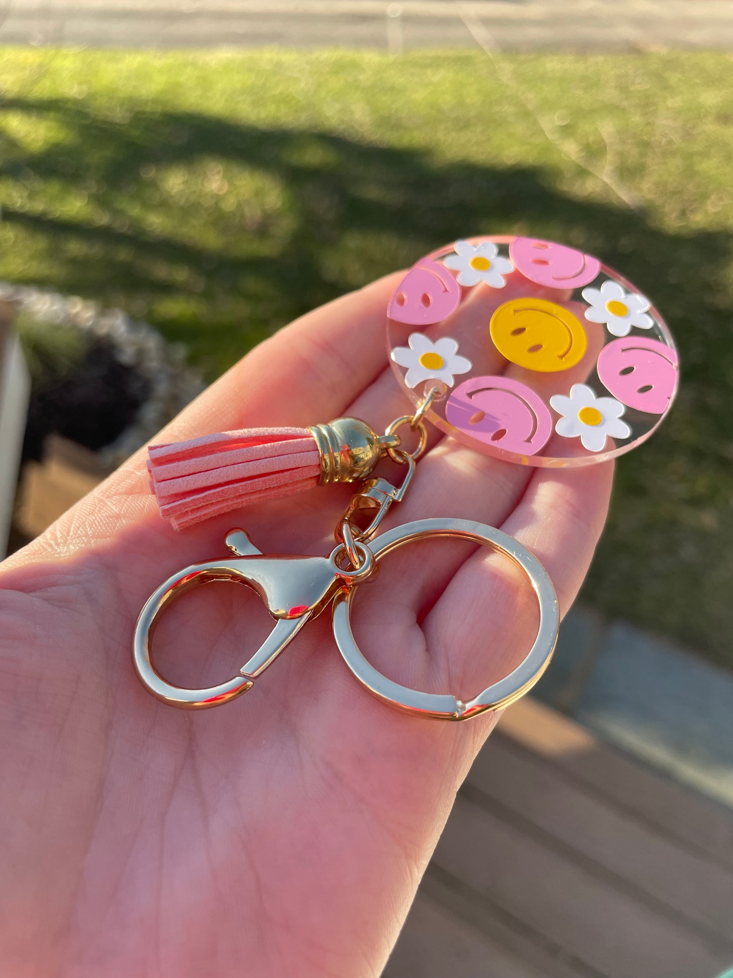 Pink and Yellow Smiley Faces and Flowers Clear Acrylic Keychain with Pink Tassel and Gold Features
