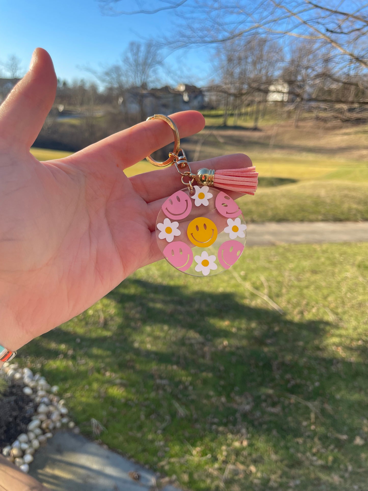 Pink and Yellow Smiley Faces and Flowers Clear Acrylic Keychain with Pink Tassel and Gold Features