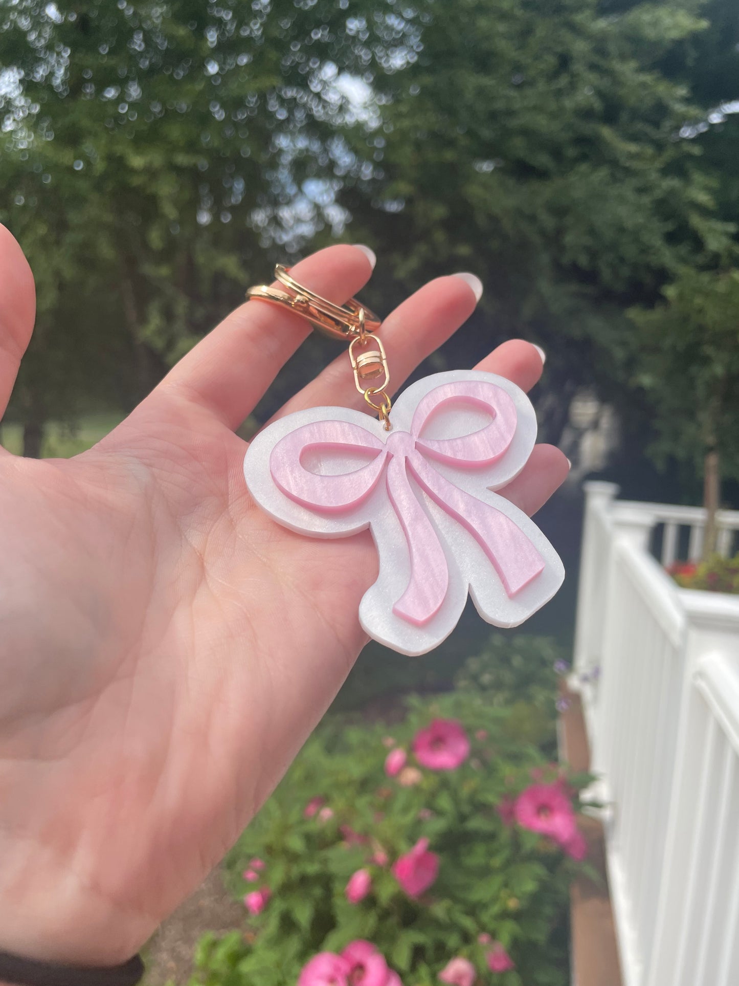 Pearlescent Pink and White Bow Keychain with Gold Features