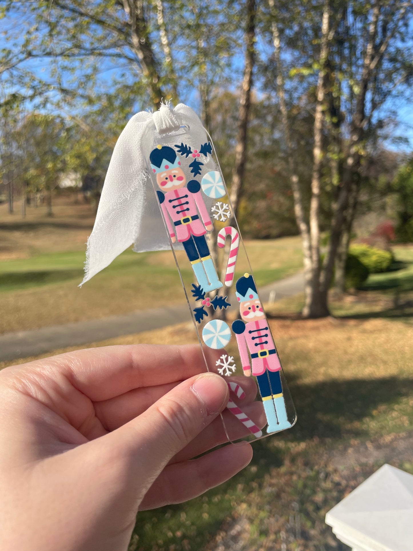 Blue Nutcrackers Holiday Clear Acrylic Bookmark with Chiffon Ribbon