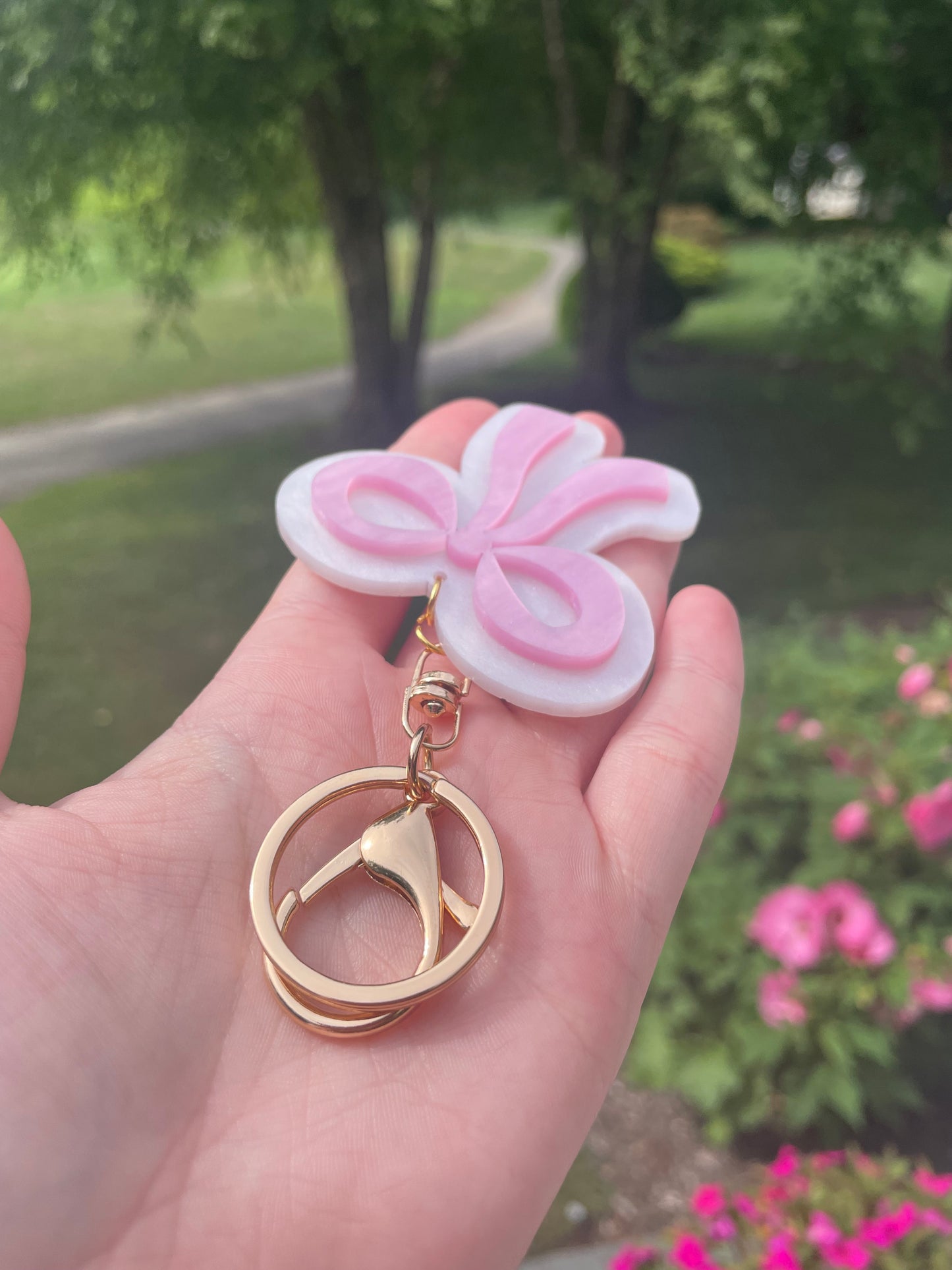 Pearlescent Pink and White Bow Keychain with Gold Features