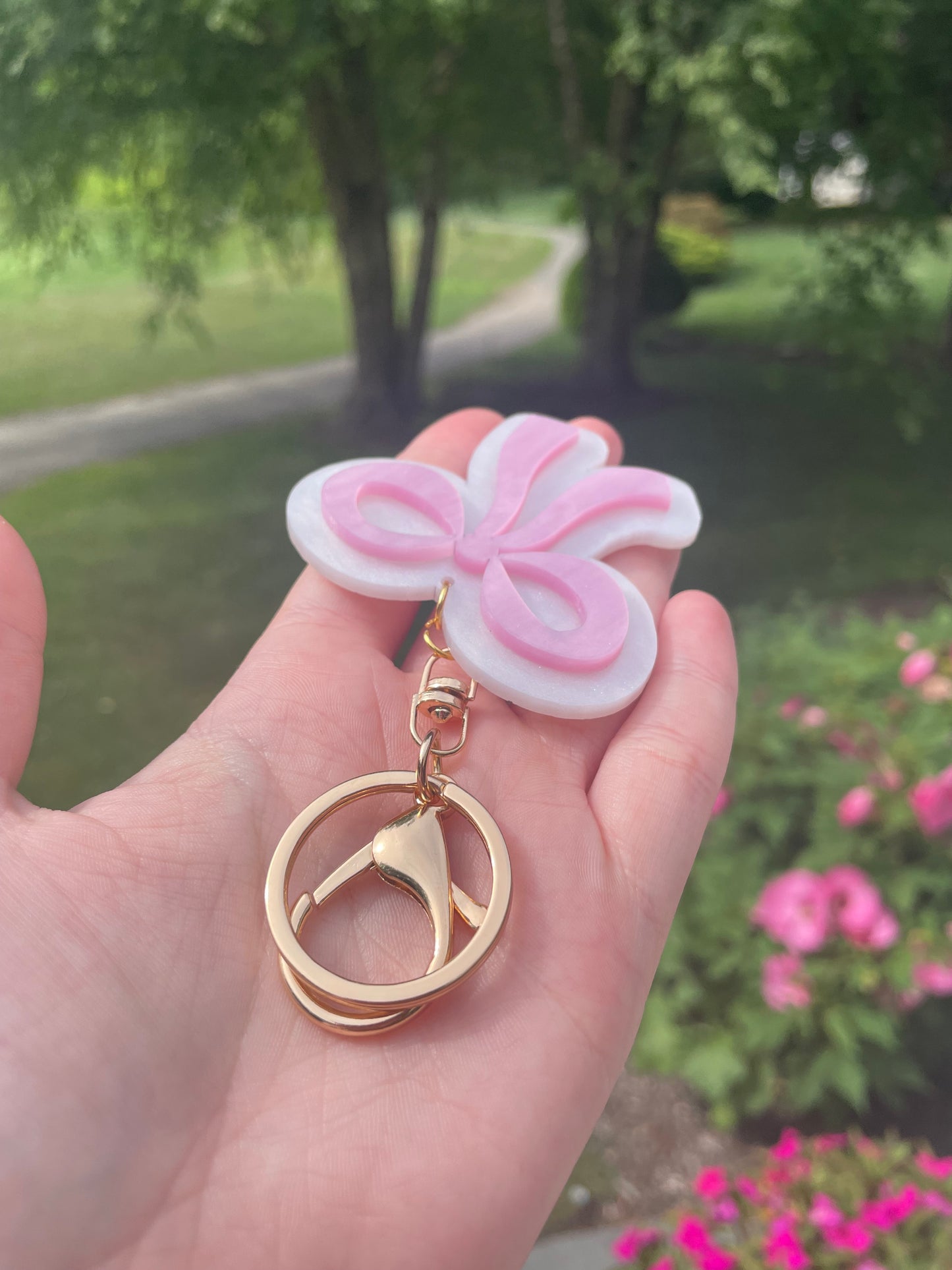 Pearlescent Pink and White Bow Keychain with Gold Features