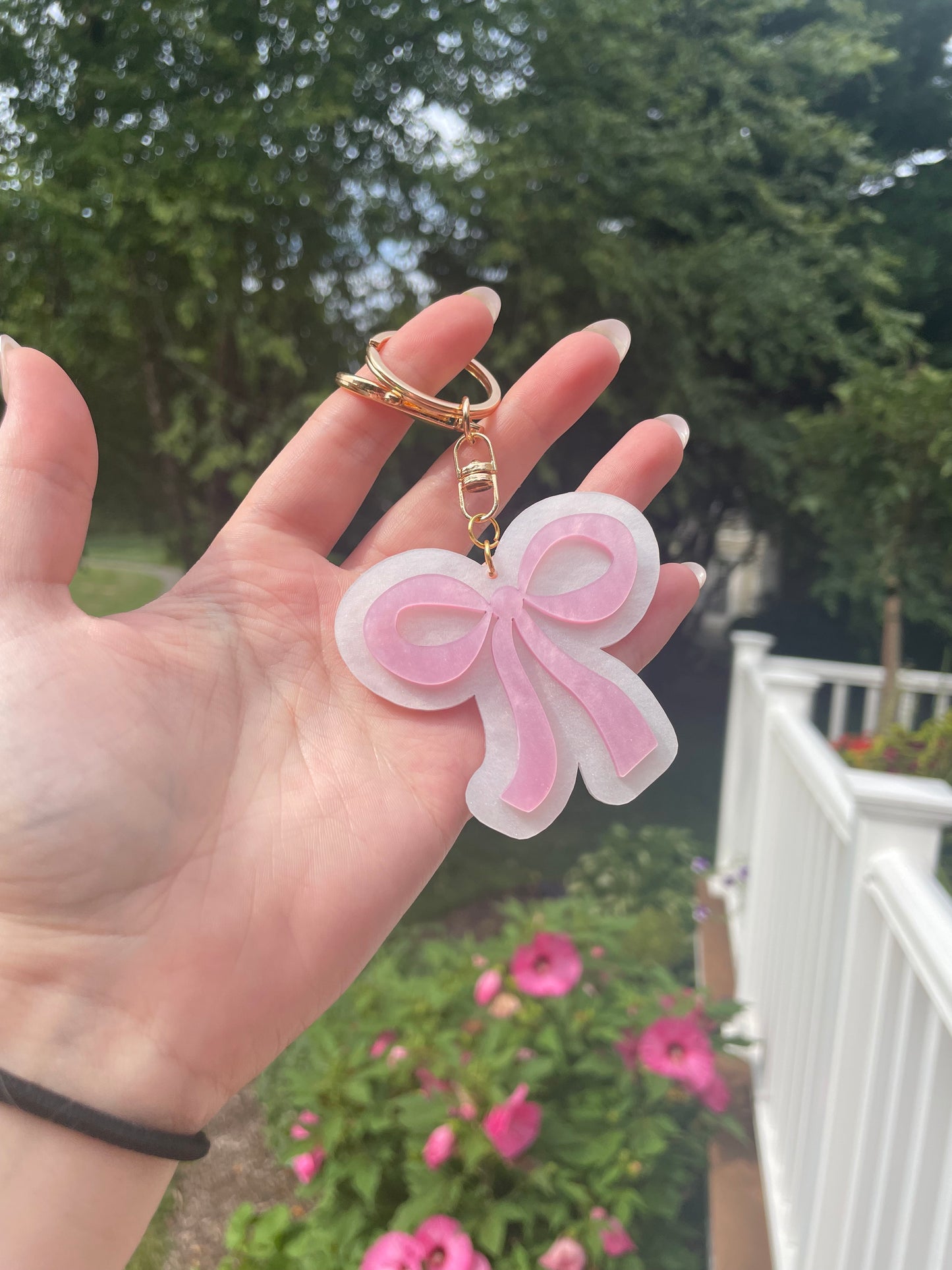 Pearlescent Pink and White Bow Keychain with Gold Features