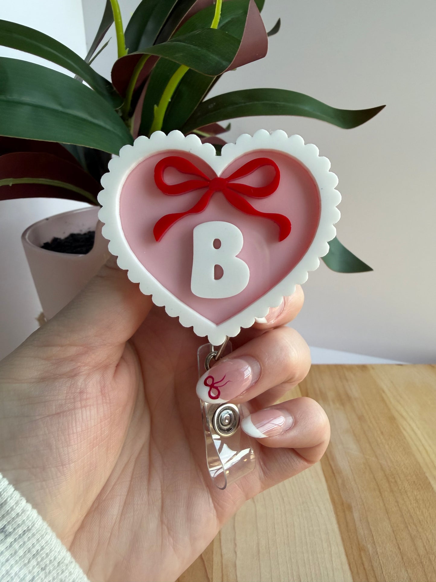 Custom Pink Scalloped Heart with a Bow Acrylic Badge Reel