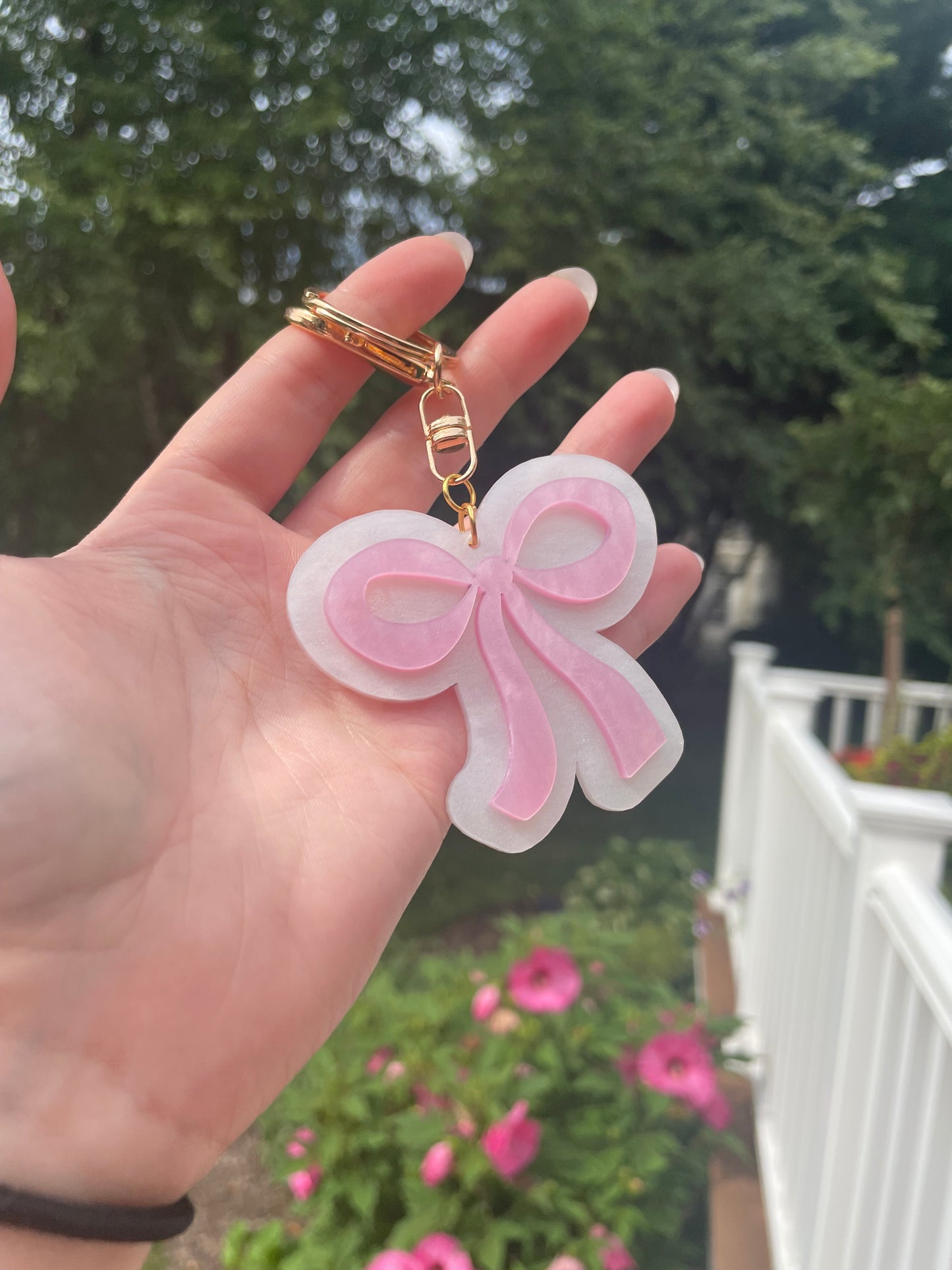 Pearlescent Pink and White Bow Keychain with Gold Features