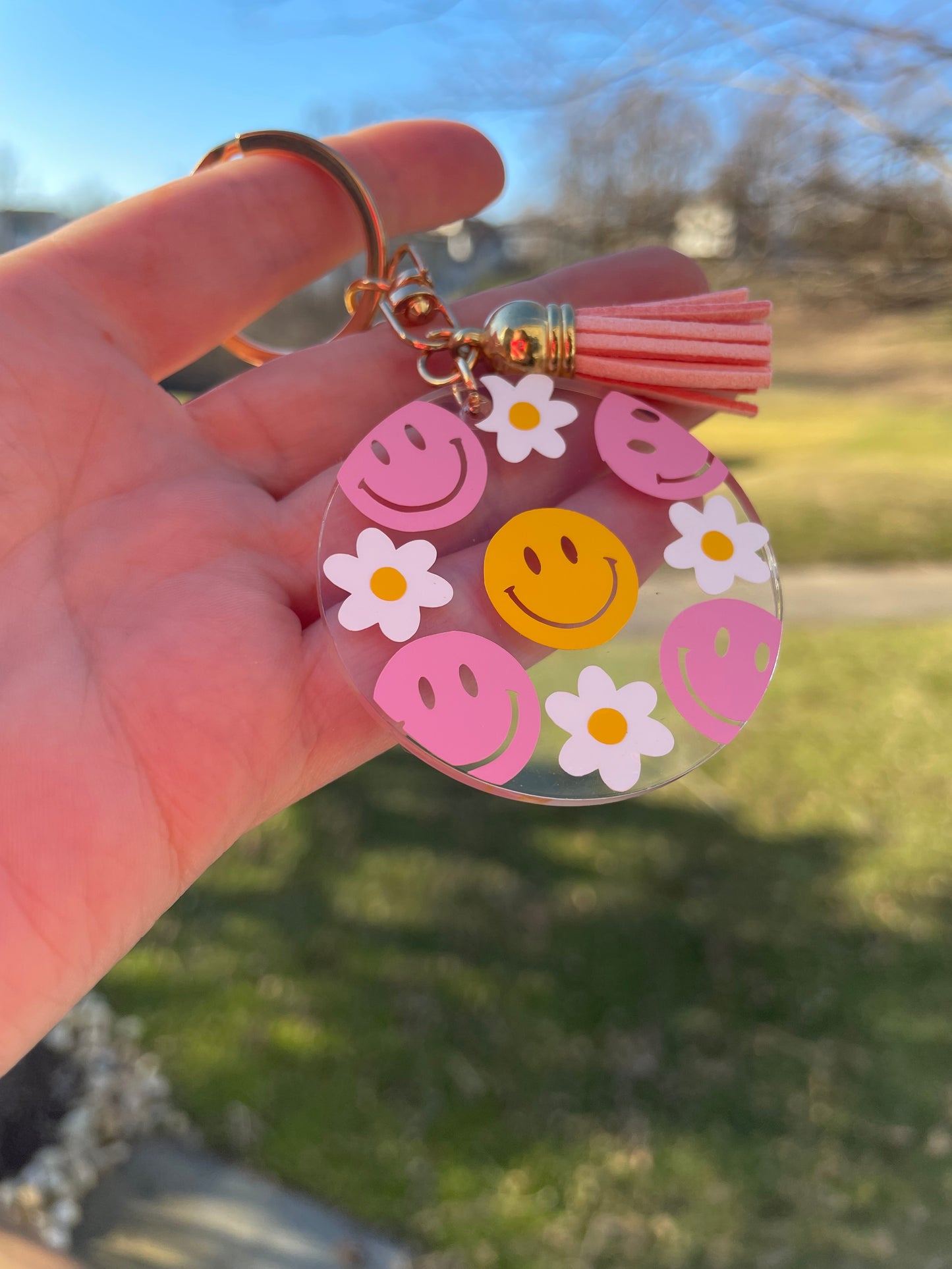 Pink and Yellow Smiley Faces and Flowers Clear Acrylic Keychain with Pink Tassel and Gold Features