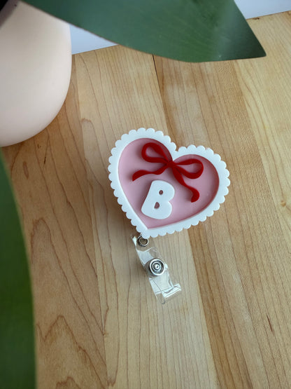 Custom Pink Scalloped Heart with a Bow Acrylic Badge Reel