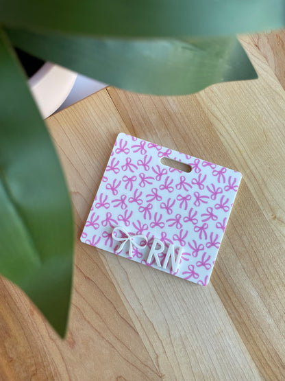Pretty Bows with White Letters Badge Backer