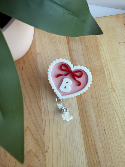 Custom Pink Scalloped Heart with a Bow Acrylic Badge Reel