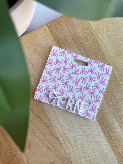 Pretty Bows with White Letters Badge Backer