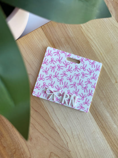 Pretty Bows with White Letters Badge Backer