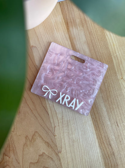 Pearl Pink with White Letters Badge Backer