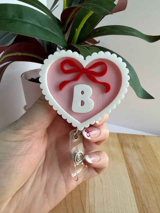 Custom Pink Scalloped Heart with a Bow Acrylic Badge Reel