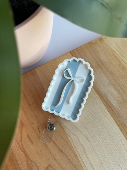 Scalloped Blue Stripe Bow Badge Reel