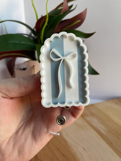 Scalloped Blue Stripe Bow Badge Reel